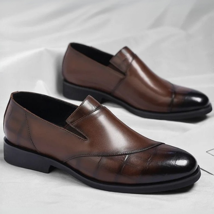 Comfortable men's brown slip-on loafers, ideal for office or sophisticated daily wear.