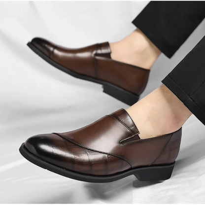 Polished black slip-on loafers for men, offering a blend of modern style and formal elegance.