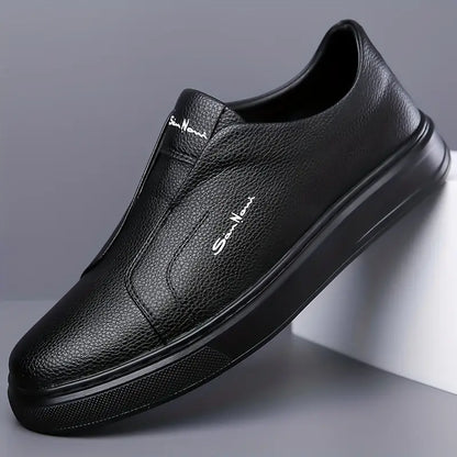 Front view of black men's slip-on sneakers, highlighting the sleek, no-lace modern style.