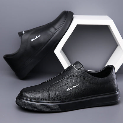 Top-down view of white men's slip-on sneakers, emphasizing their clean lines and modern design.