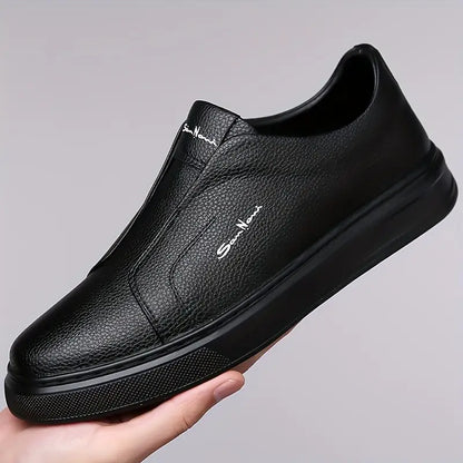 Man wearing brown slip-on sneakers, demonstrating casual comfort and modern street style.