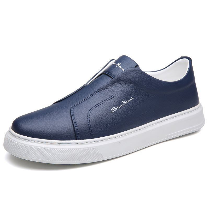 Lifestyle shot: Man walking in navy blue slip-on sneakers, showcasing everyday comfort & style.