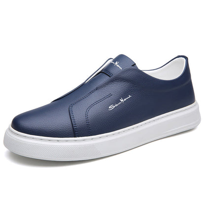 Lifestyle shot: Man walking in navy blue slip-on sneakers, showcasing everyday comfort & style.