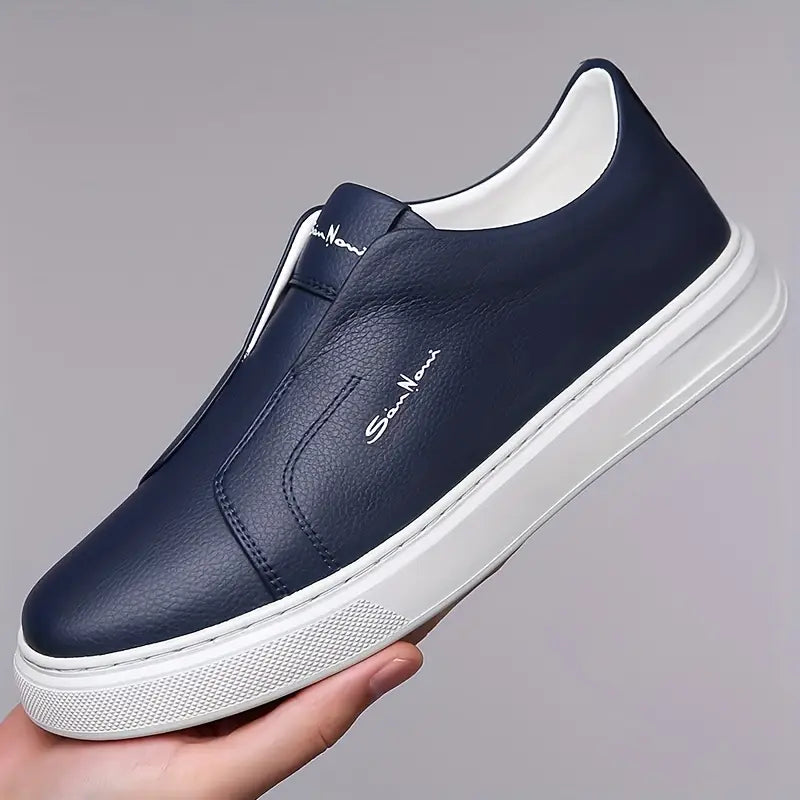 White men's slip-on sneakers, sleek and modern. Perfect comfortable shoes for casual wear.