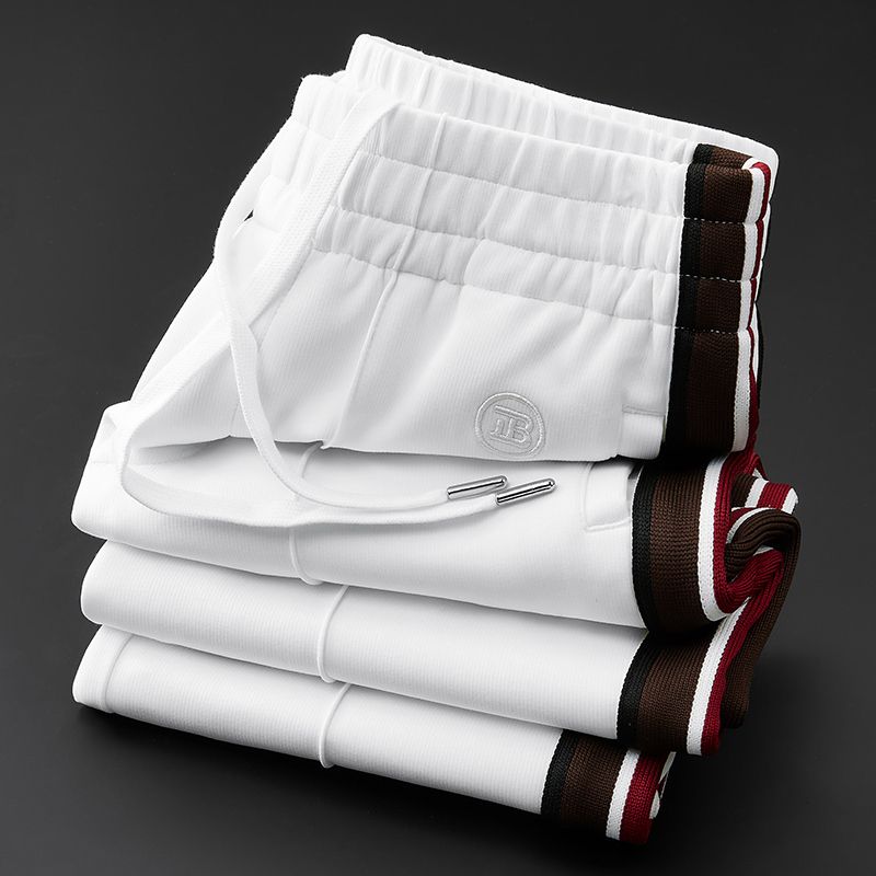 Modern men's spliced design pants, perfect for urban fashion & relaxed everyday style.