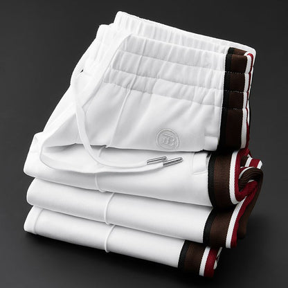 Modern men's spliced design pants, perfect for urban fashion & relaxed everyday style.