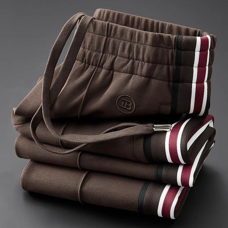Versatile men's comfort pants with a unique spliced design & easy-care elastic waist.