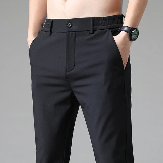 Men's modern straight fit performance pants in black, front view. Versatile for office or casual wear.