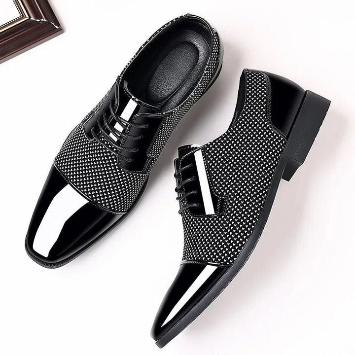 Front view of men's modern oxford dress shoes. Elegant textured pattern & comfortable fit for formal occasions.