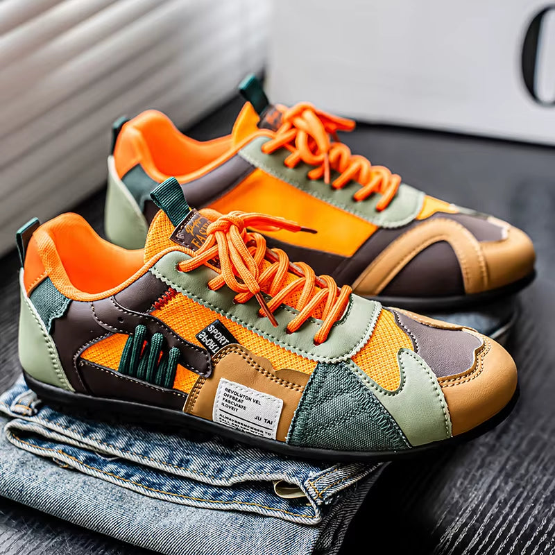 Durable men's multi-panel trainers, stylish for streetwear and active use.