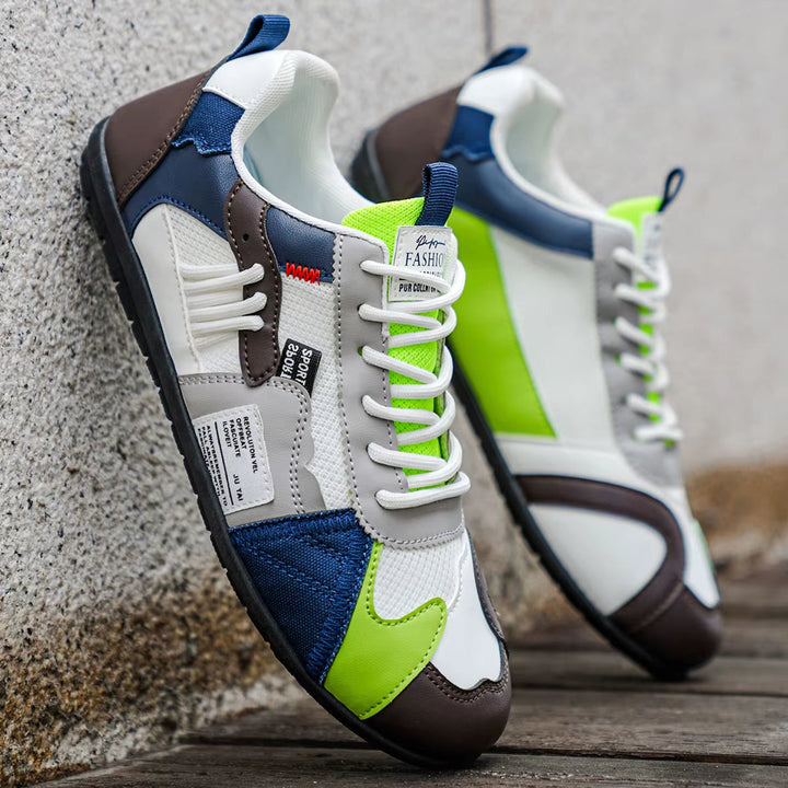 Fashionable men's streetwear trainers with multi-panel design, versatile for everyday outfits.
