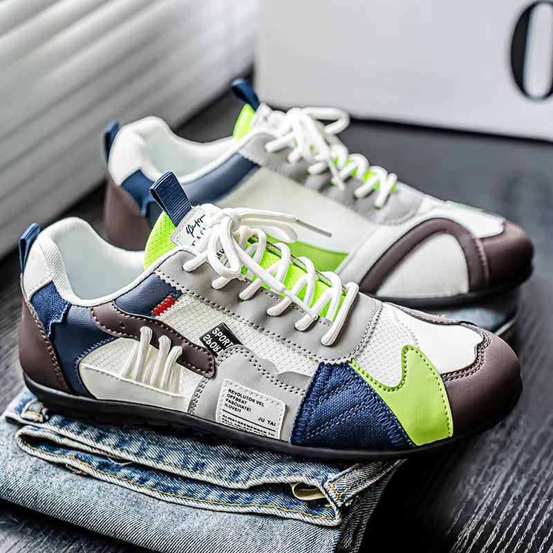 Modern men's athletic trainers, multi-panel style for comfort and streetwear fashion.