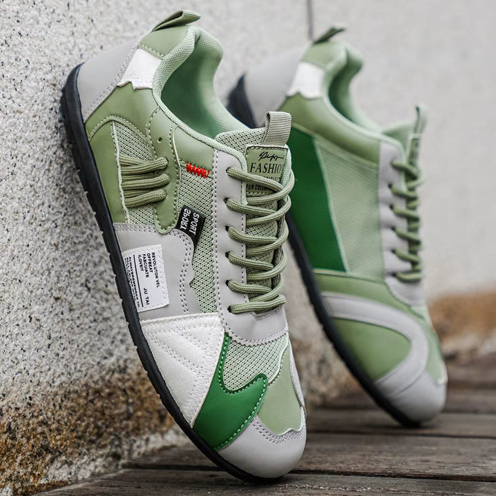 Sleek multi-panel men's trainers, offering durable comfort for streetwear and daily activities.