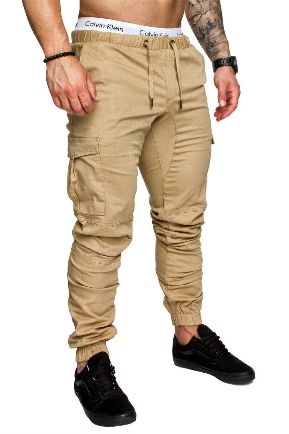 Close-up of men's cargo pants pocket with flap closure, for casual outdoor use