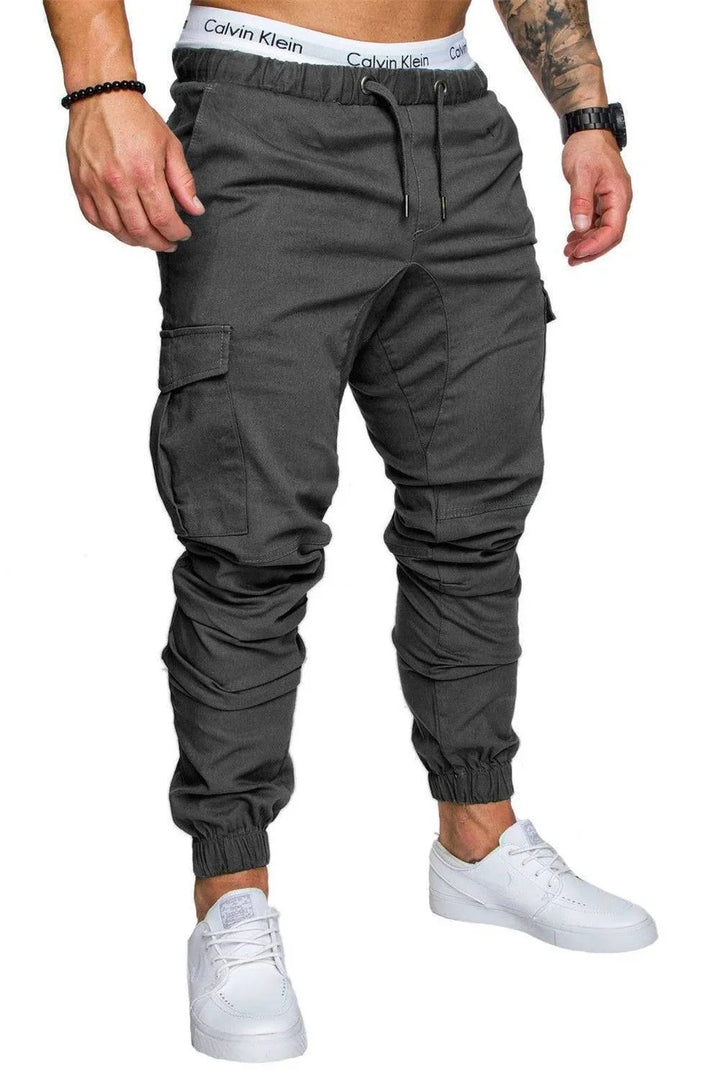 Men's apparel: blue multi-pocket cargo pants, elastic waist, versatile for outdoor and casual wear