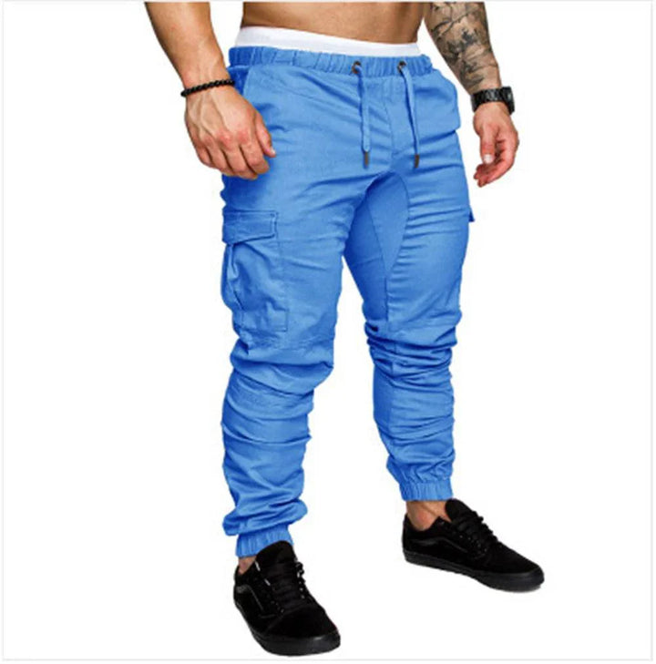 Flat lay of men's cargo pants, showcasing all utility pockets, ideal for spring style and outdoor use
