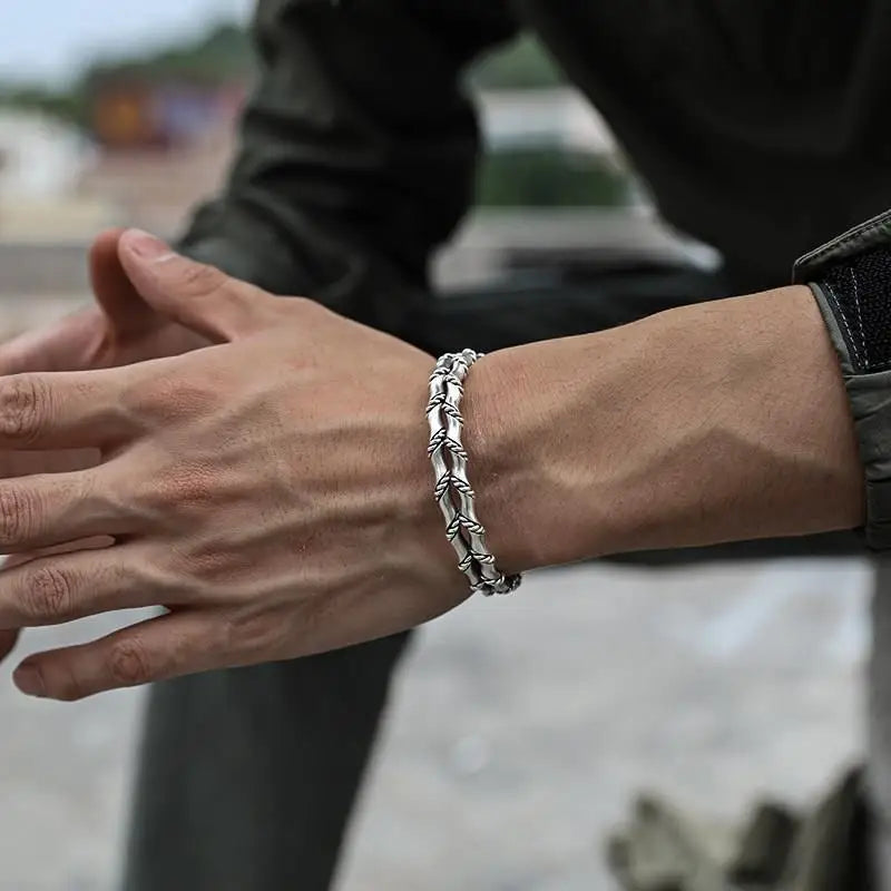 Stylish men's adjustable bracelet featuring natural wood and sleek stainless steel Cuban link design.
