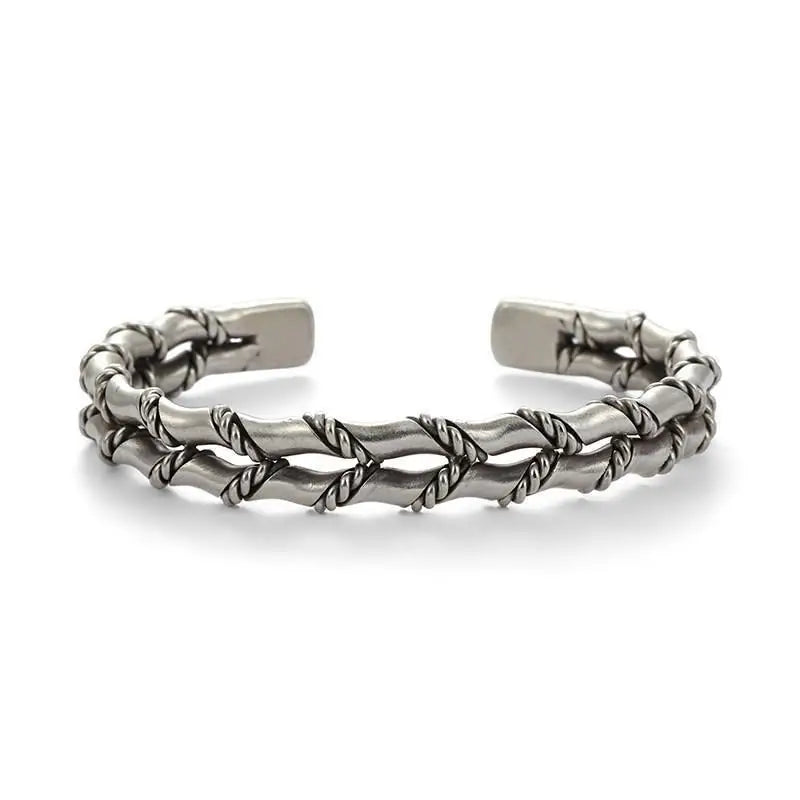 Modern men's accessory: natural wood and stainless steel Cuban link bracelet. Adjustable, durable jewelry.