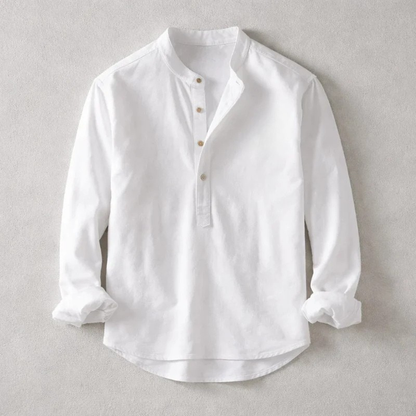 Close-up of a men's blue tailored Henley shirt, showing fabric texture & button placket. Casual long sleeve.