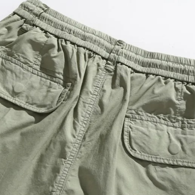 Khaki Northbay men's cargo shorts, deep pockets for utility & everyday comfort during summer activities.