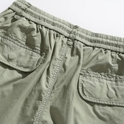 Khaki Northbay men's cargo shorts, deep pockets for utility & everyday comfort during summer activities.