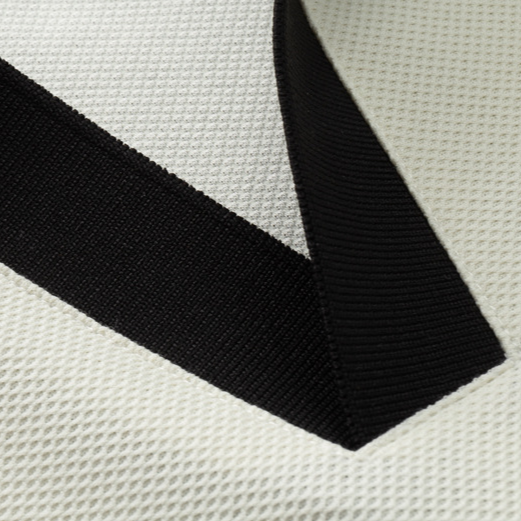 Odyssey men's knit polo in off-white. Stretch-knit, collared shirt, ideal for a comfortable, stylish look.