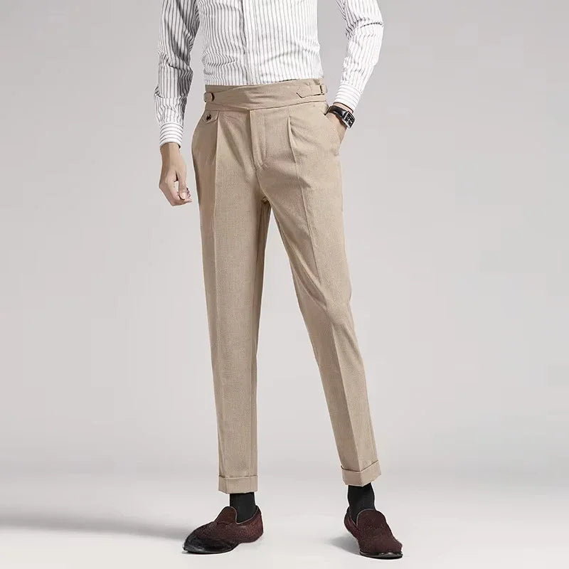 Man wearing classic old money style pleated dress trousers, styled for a smart casual look.