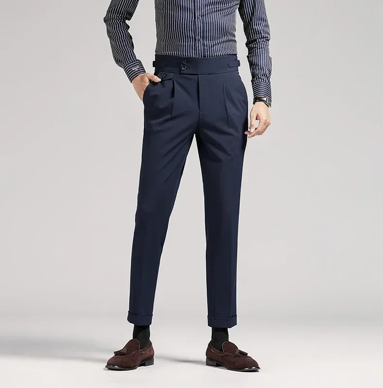 Black tailored fit men's dress trousers, pleated, classic old money fashion for events.