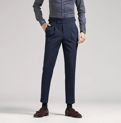 Black tailored fit men's dress trousers, pleated, classic old money fashion for events.