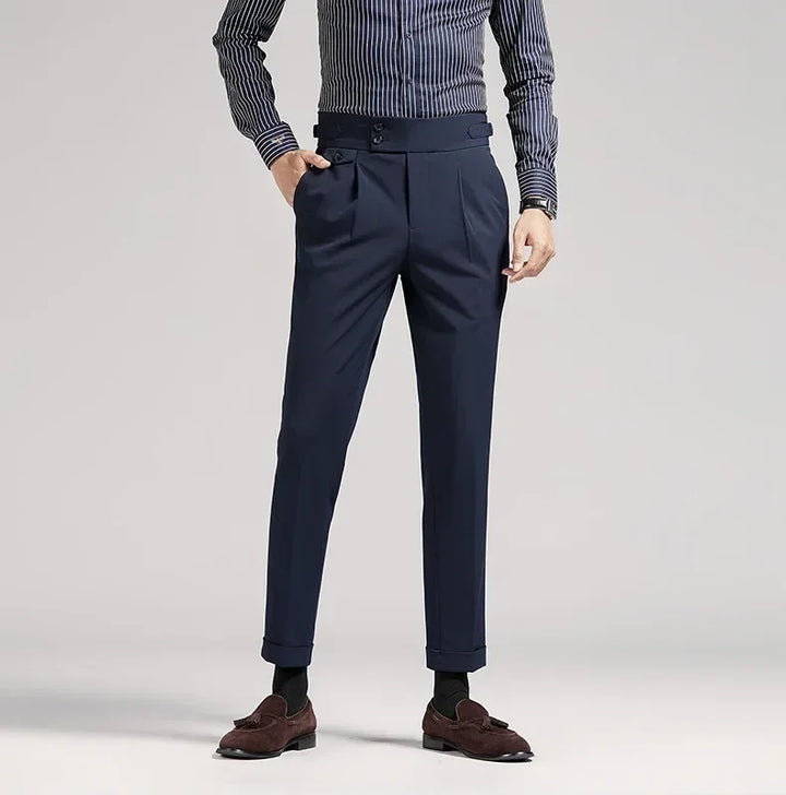 Black tailored fit men's dress trousers, pleated, classic old money fashion for events.