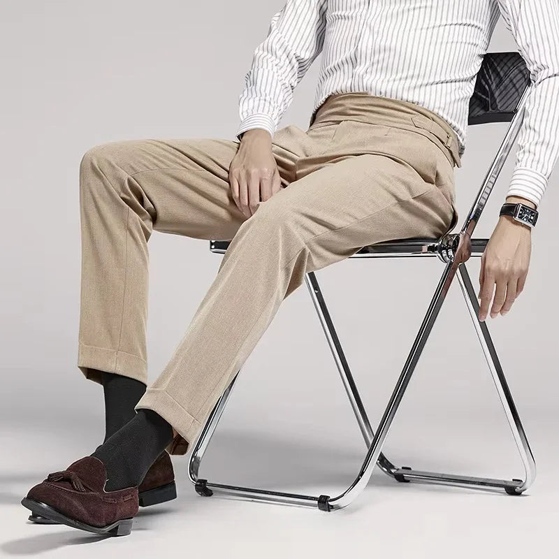 Tailored fit men's pleated dress trousers, exuding old money style; classic men's fashion.