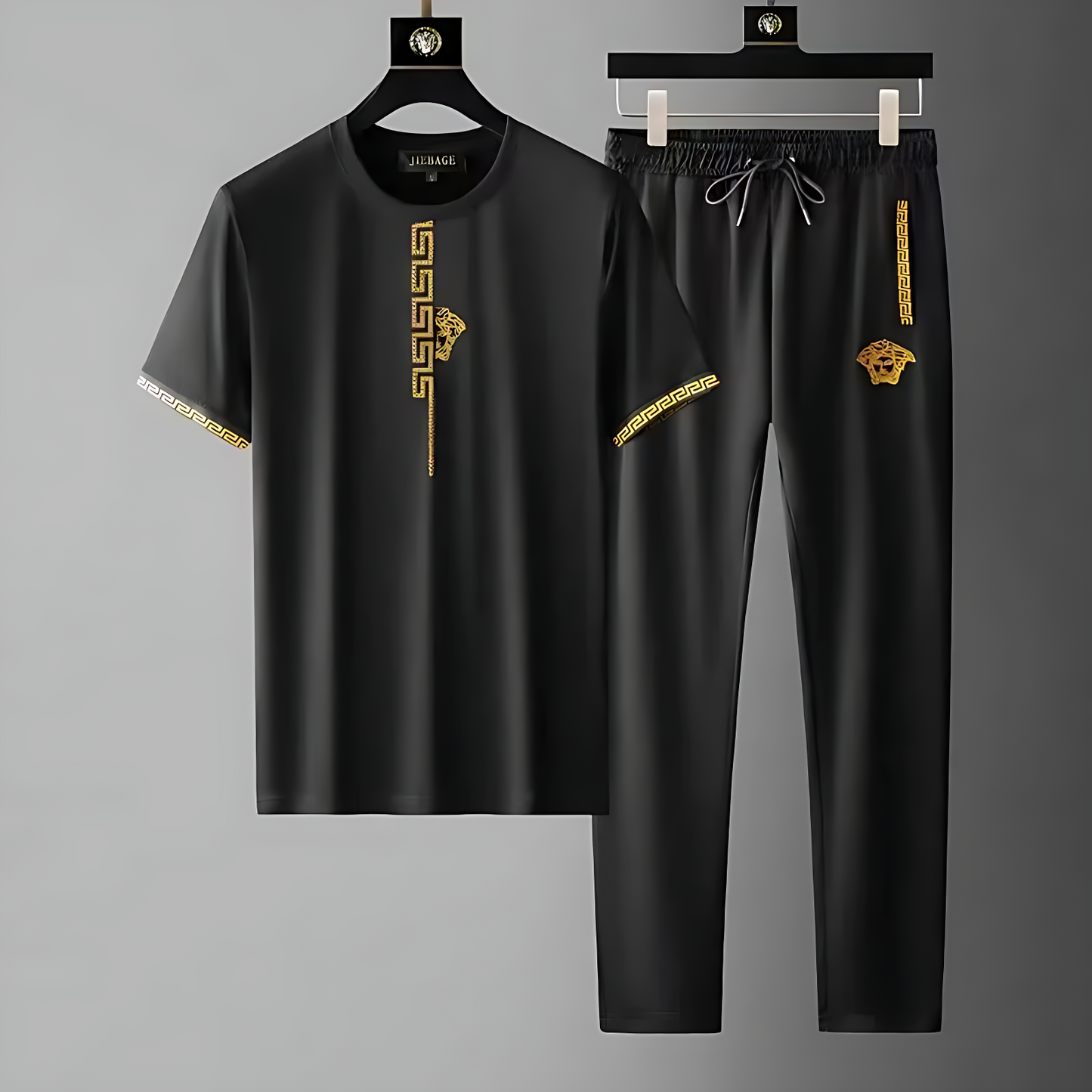 Men's Olympia tracksuit set, sleek black design with embroidered Greek key pattern, ideal for streetwear & athletic style.