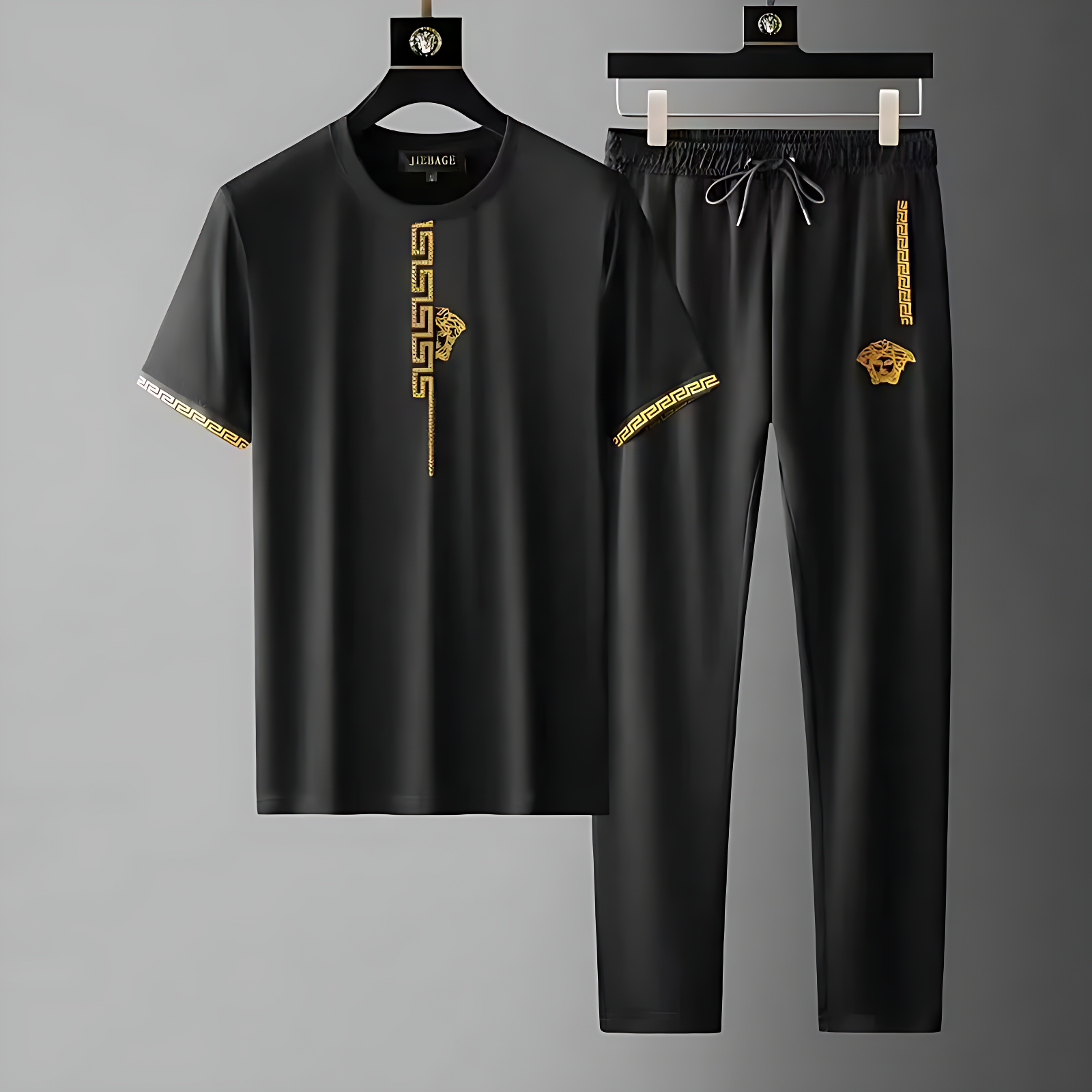 Men's Olympia tracksuit set, sleek black design with embroidered Greek key pattern, ideal for streetwear & athletic style.