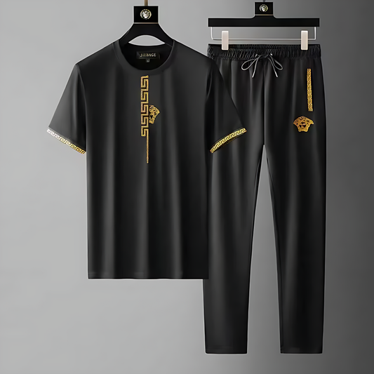 Men's Olympia tracksuit set, sleek black design with embroidered Greek key pattern, ideal for streetwear & athletic style.