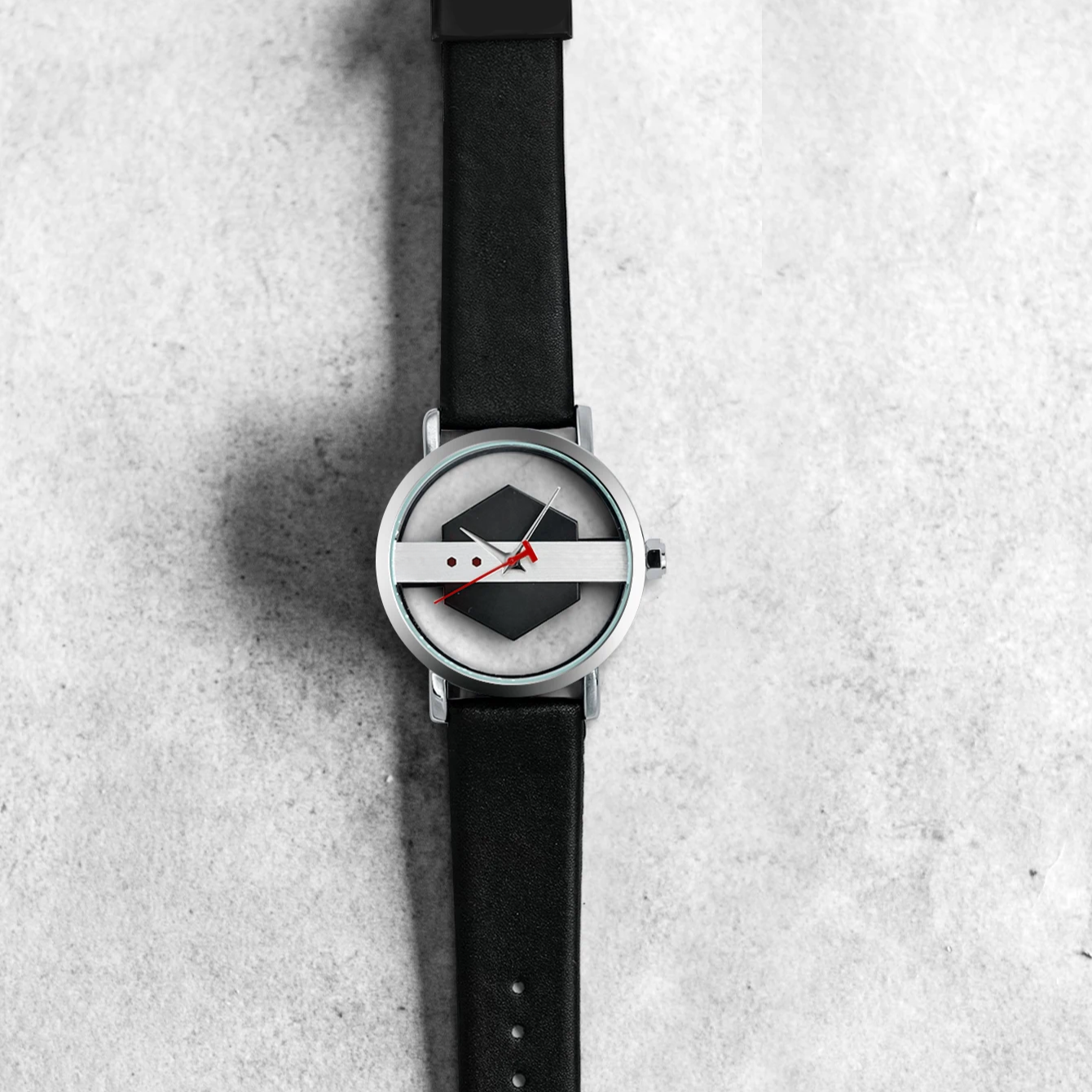Modern men's Orbit Dial Watch with polished steel bezel and unique open dial design, a stylish accessory.