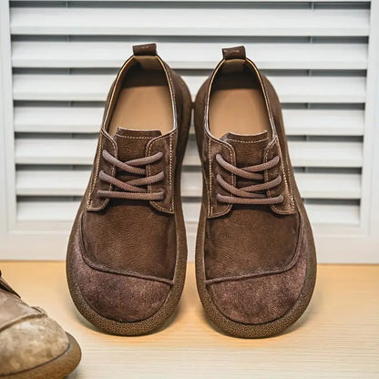 Orthopedic sole detail on men's brown leather casual loafers, designed for superior walking comfort.