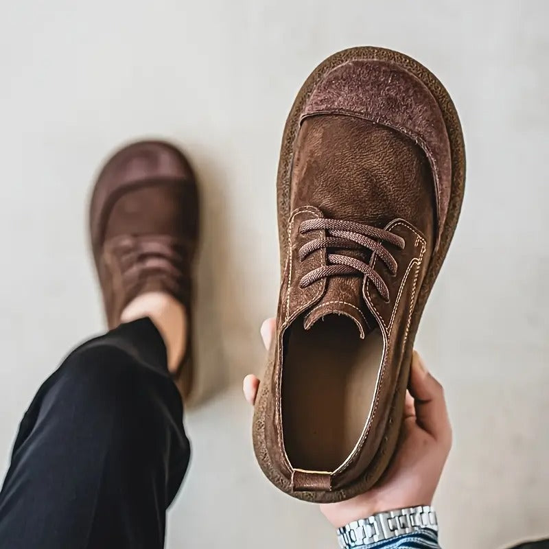 Brown casual leather loafers for men, offering orthopedic comfort and versatile style.