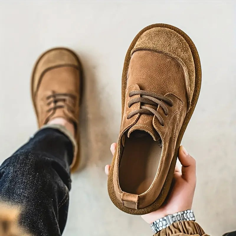 Front view of brown handcrafted men's leather loafers, orthopedic and comfortable for casual wear.