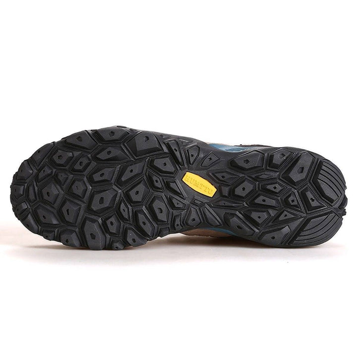 Close-up of men's hiking shoes showing breathable material and sturdy lacing for hiking