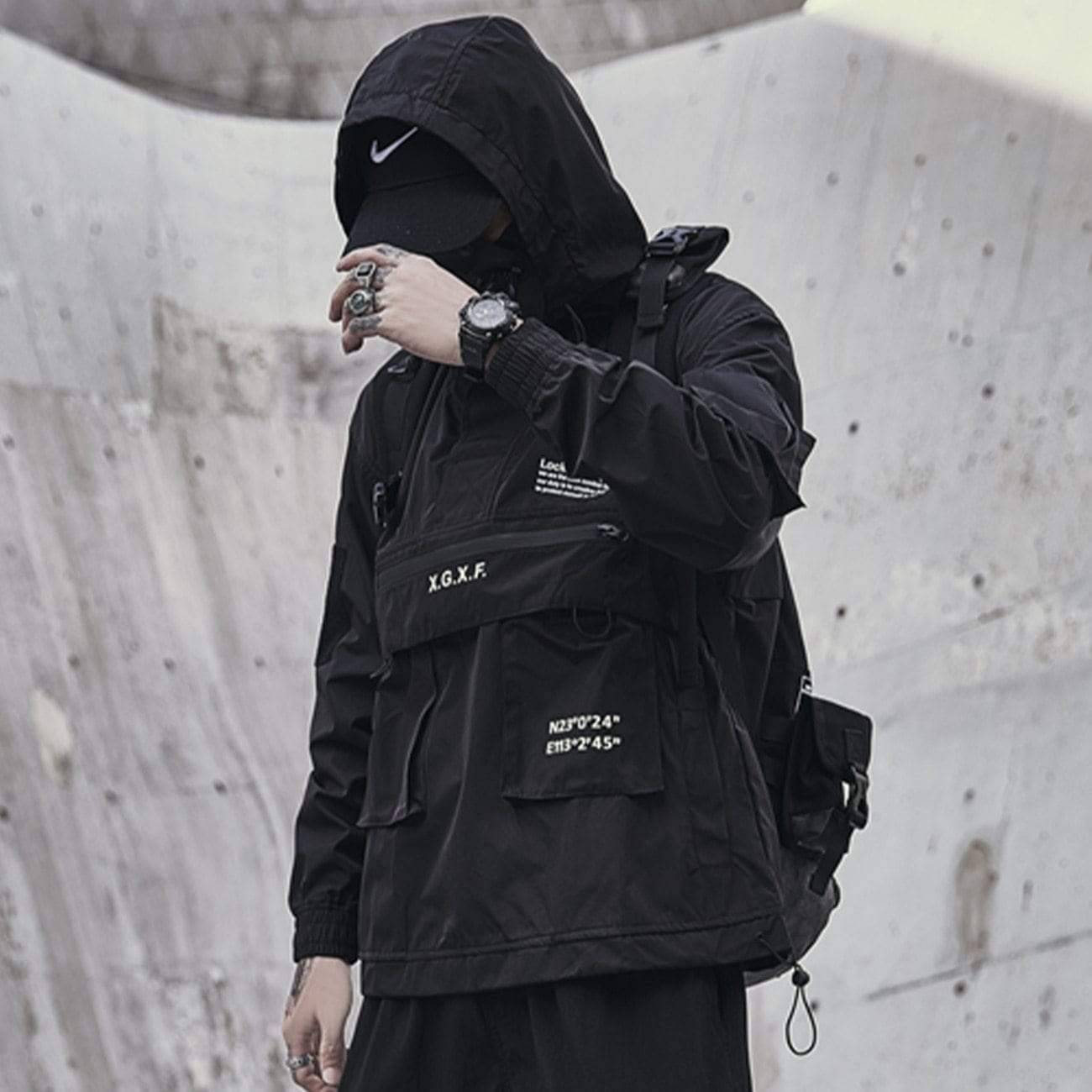 Rugged men's hooded tactical jacket in a neutral color, perfect for outdoor activities