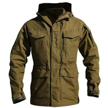 Side profile of a man wearing a tactical hiking jacket with hood, functional outdoor apparel