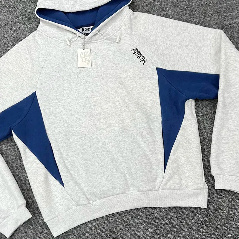 Men's oversized hoodie with contrast panels, perfect for casual streetwear.