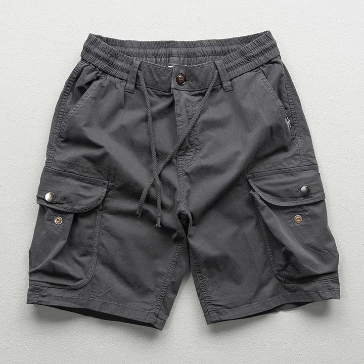 Relaxed man in comfortable Palermo cargo shorts, perfect for casual summer outings & everyday versatile wear.