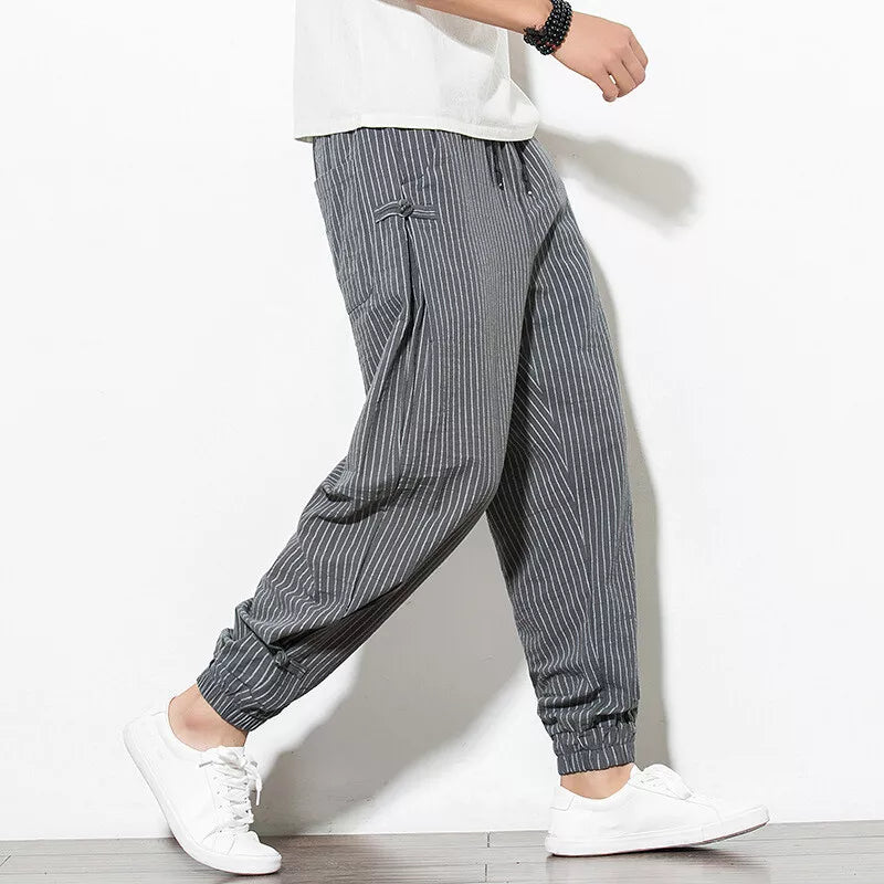Man in relaxed fit Palisade pinstripe joggers, showcasing ultimate comfort & effortless casual style.