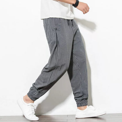 Man in relaxed fit Palisade pinstripe joggers, showcasing ultimate comfort & effortless casual style.