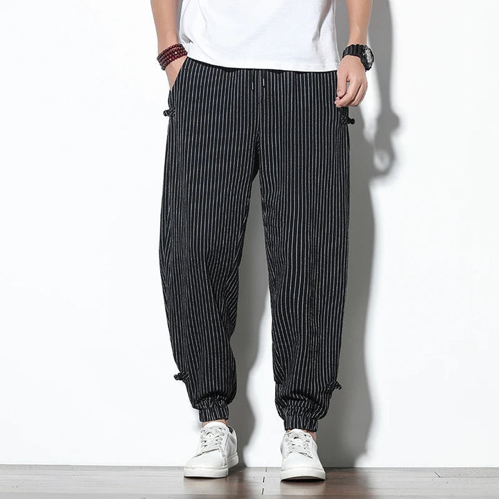 Essential men's pinstripe joggers, ultimate comfort, relaxed fit, perfect for versatile everyday wear.