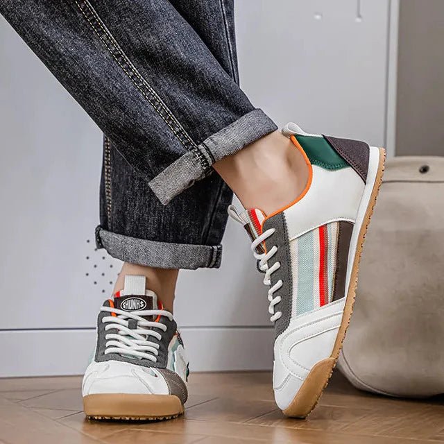 Rugged men's utility sneakers with patchwork detail. Durable footwear for hiking, urban use, and casual comfort.