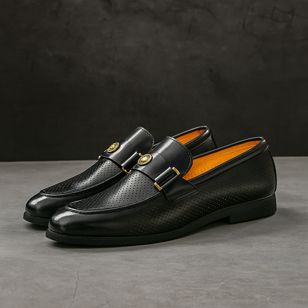 Classic black men's perforated loafers, ideal for dress or casual, ensuring breathable comfort.