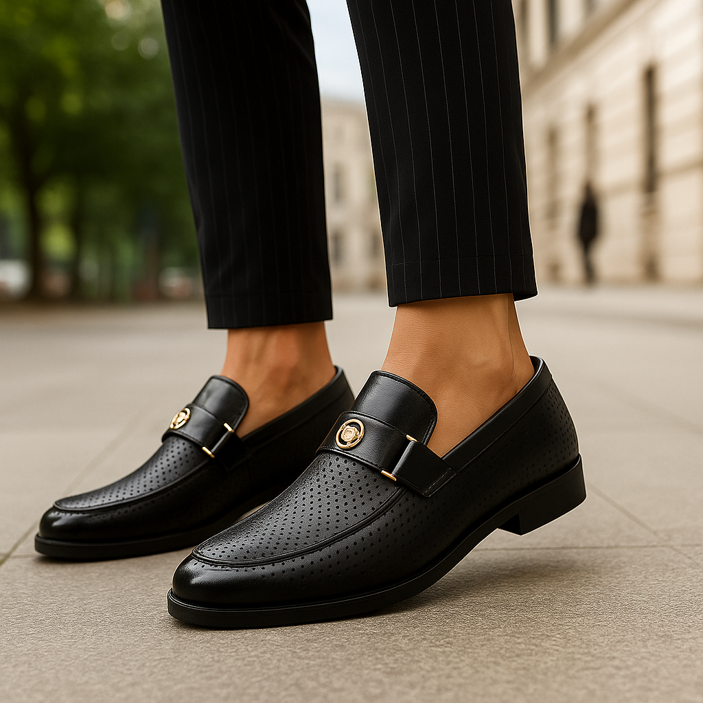 Detailed view of men's perforated loafers, highlighting breathable texture & refined slip-on footwear.