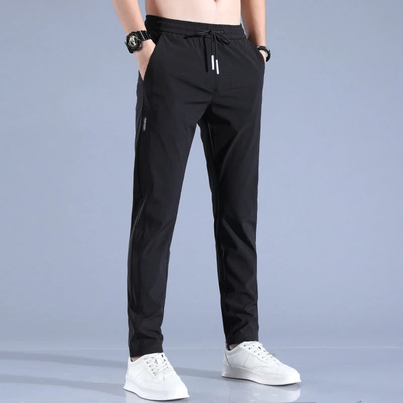 Stylish men's golf trousers, black, offering athletic performance and all-day comfort for golfers.
